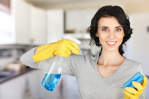 Professional carpet cleaner following health and safety procedures on site